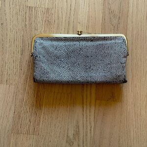 Like new leather HOBO Lauren wallet with gold hardware.